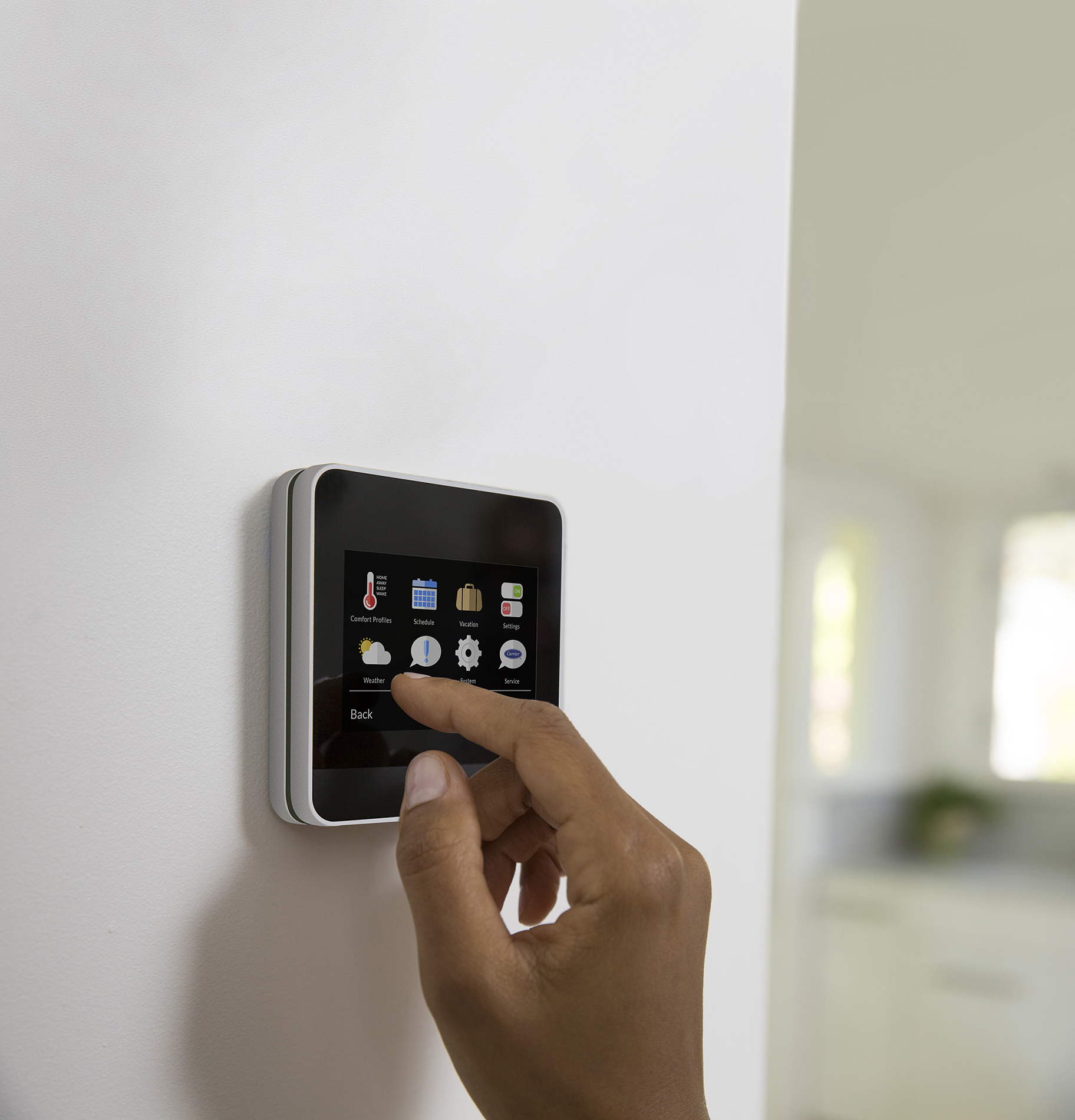 https://webrown.com/wp-content/uploads/2018/11/Carrier-COR-Thermostat-on-Wall.jpg